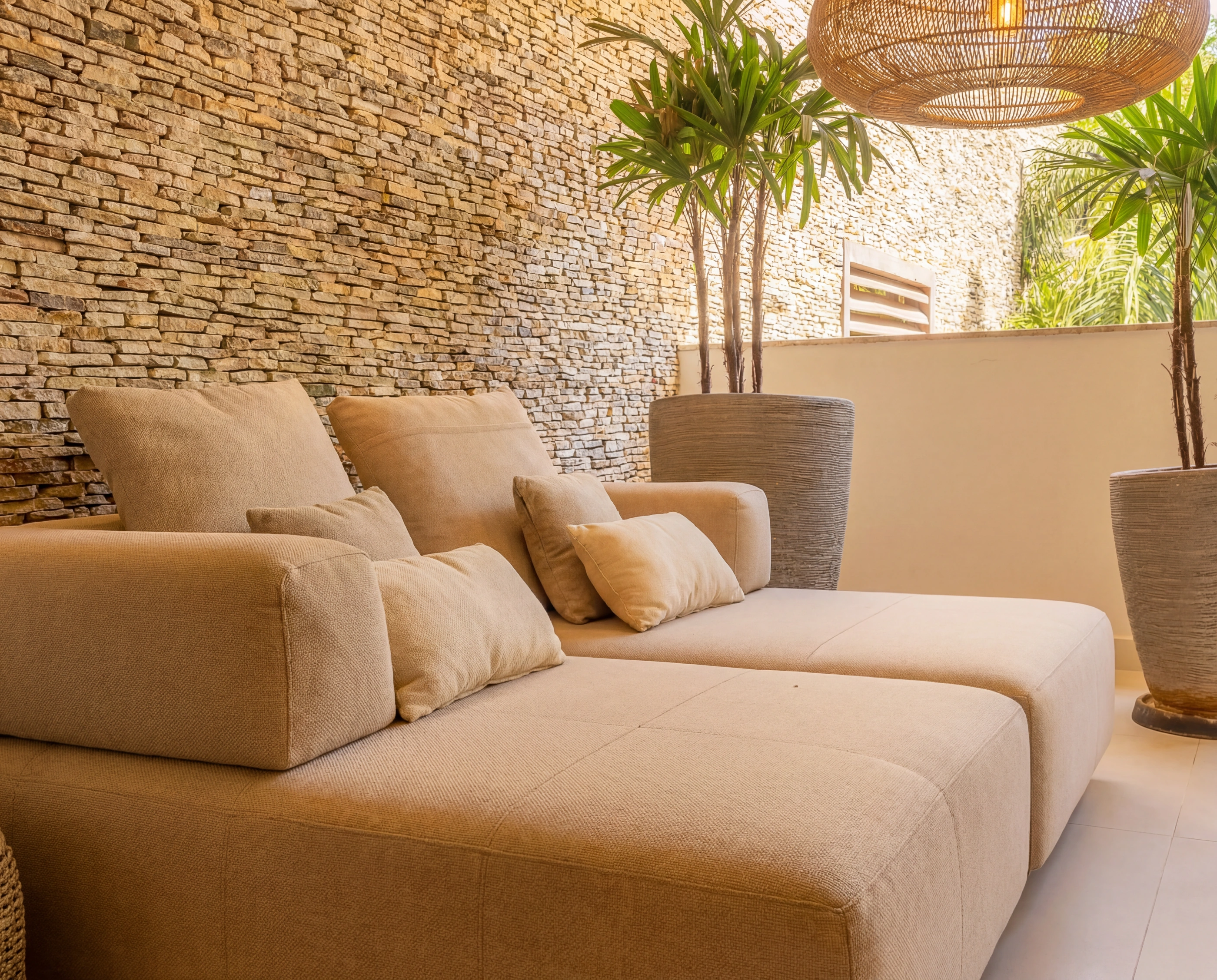 lounge beige sofa stone wall