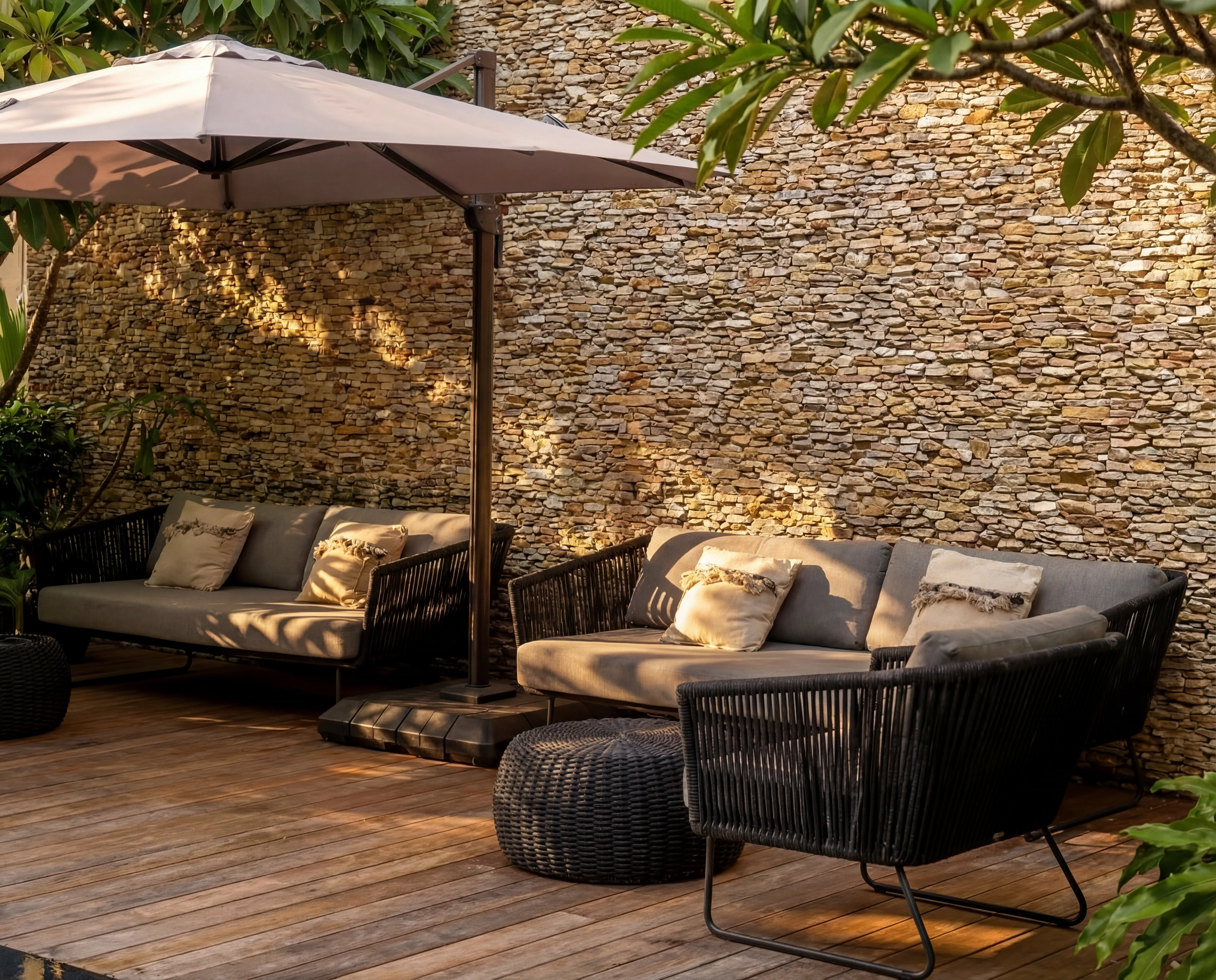 deck sofas umbrella stone wall daylight