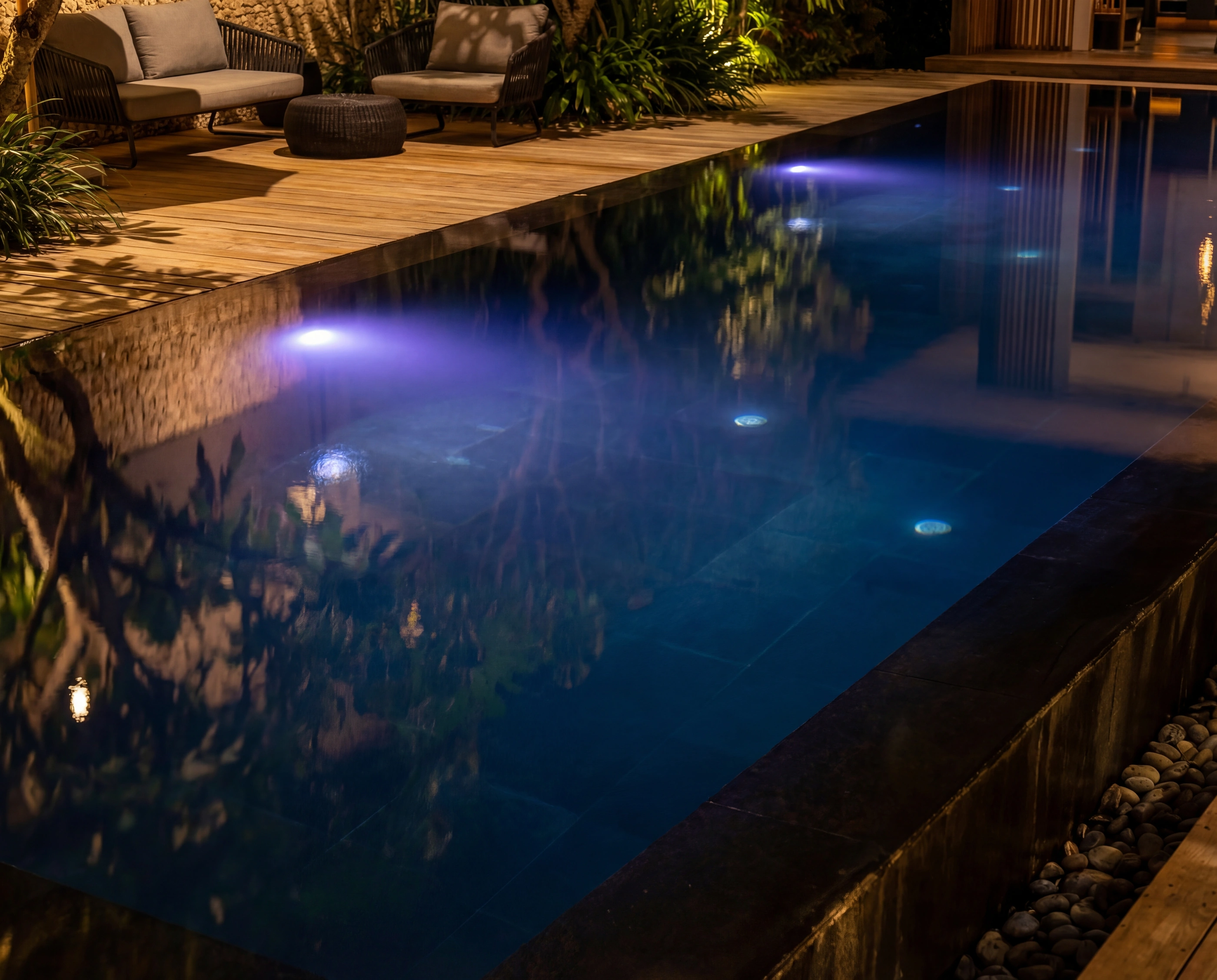 pool evening blue lights loungers